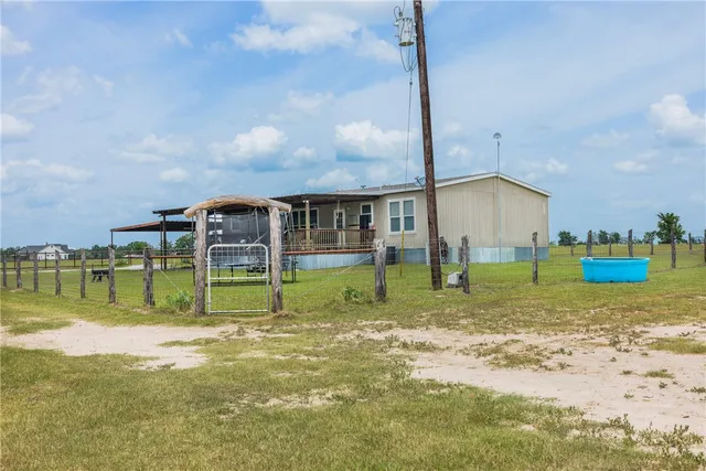a view of a park with a large trees