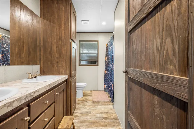 a view of a chair and tables in the balcony