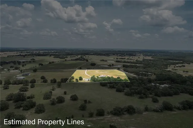 a balcony with table and chairs
