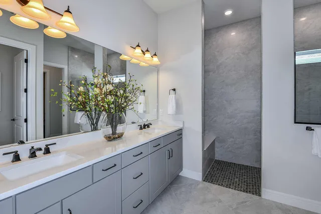 a bathroom with a double vanity sink and a mirror