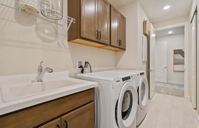 a utility room with dryer and washer