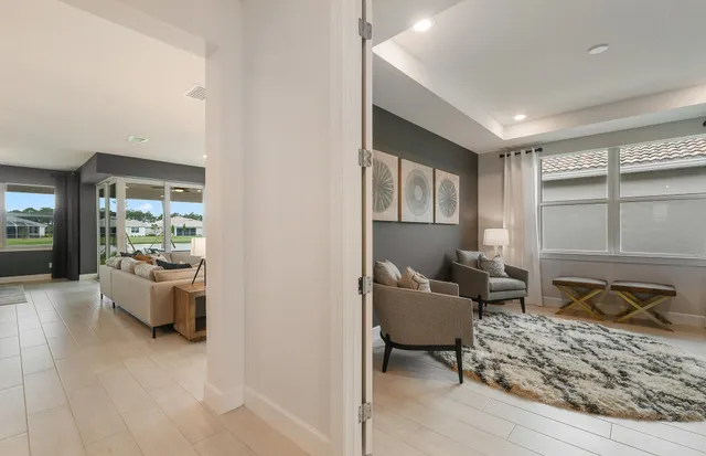 a living room with furniture and a window