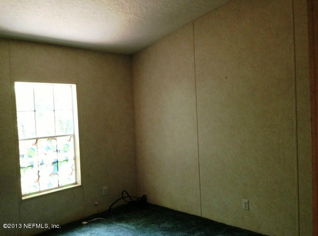 96135 Durden Road Yulee, FL 32097 - Photo 8 of 10 a view of an empty room and window