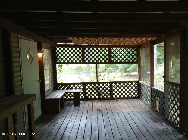 96135 Durden Road Yulee, FL 32097 - Photo 10 of 10 a view of a wooden door of a house