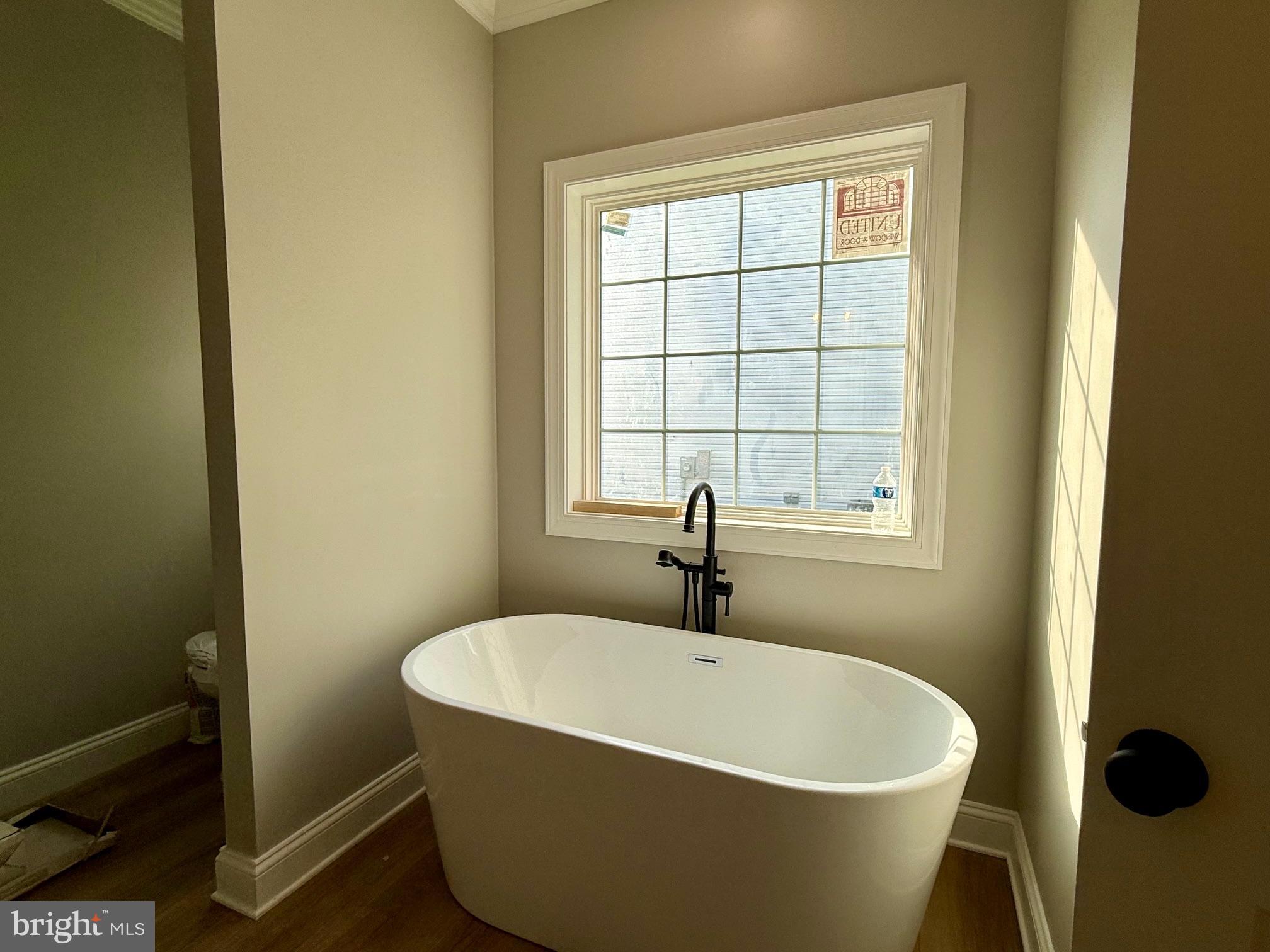17480 Lighthouse Commons Drive Piney Point, MD 20674 - Photo 14 of 23 a white bath tub sitting next to a window