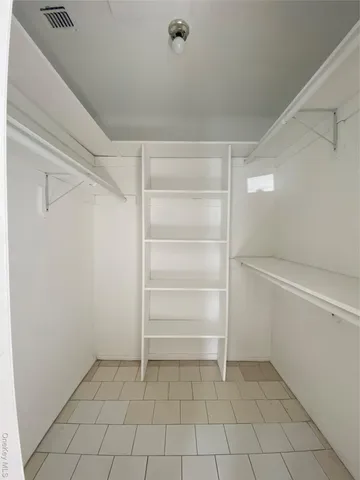 a view of an empty walk in closet
