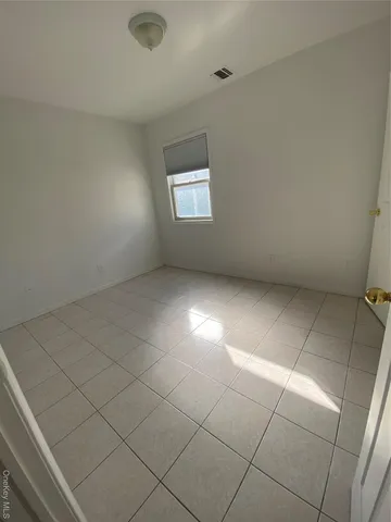 an empty room with a bathroom