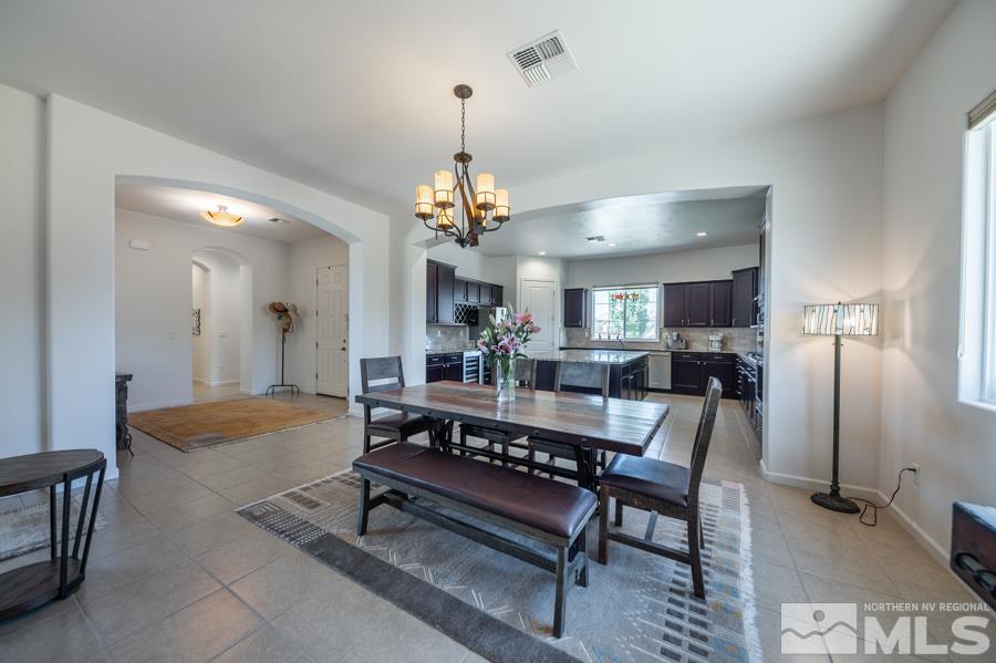 30 Phaethon Court Reno, NV 89521 - Photo 12 of 39 a view of a dining room with furniture and chandelier