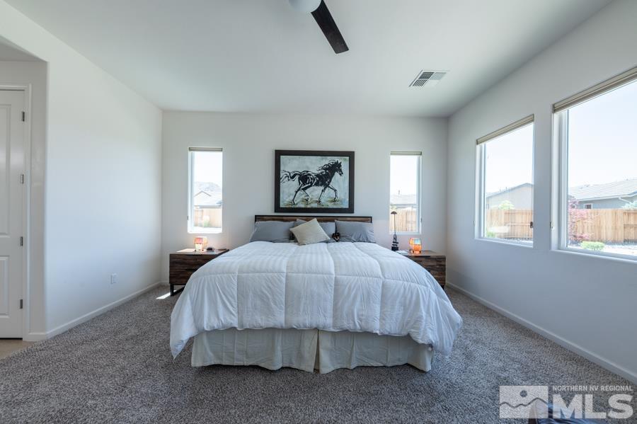 30 Phaethon Court Reno, NV 89521 - Photo 15 of 39 a bedroom with a large bed and a window
