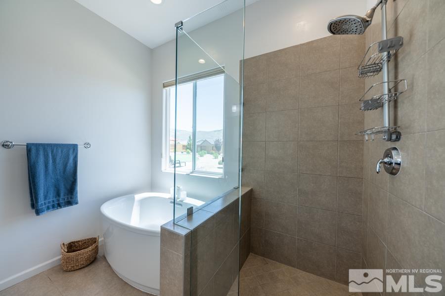 30 Phaethon Court Reno, NV 89521 - Photo 17 of 39 a bathroom with a granite countertop sink and a bathtub
