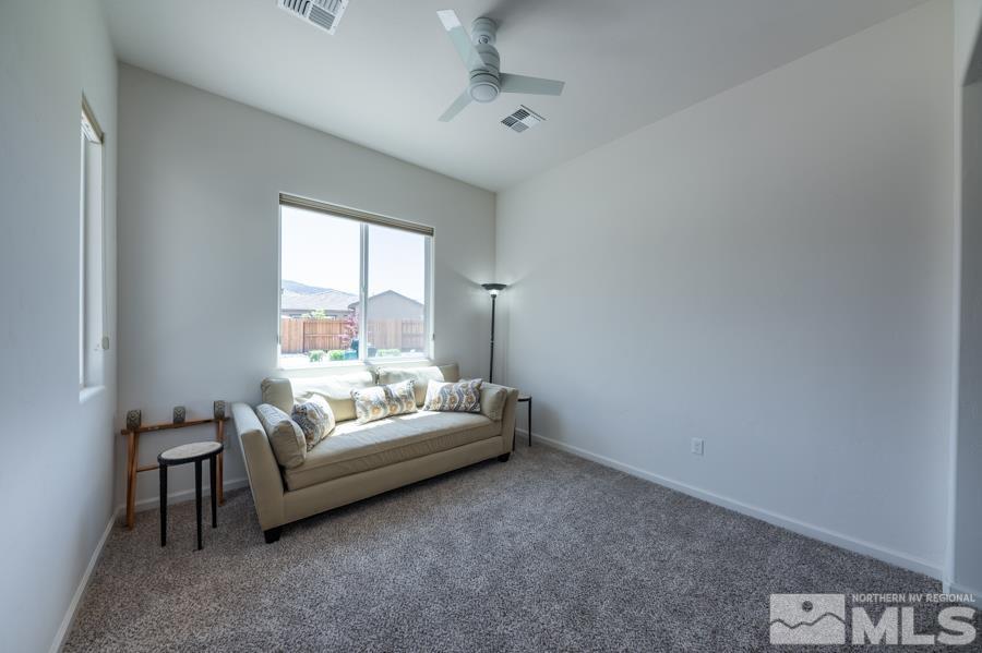 30 Phaethon Court Reno, NV 89521 - Photo 24 of 39 a living room with furniture and a window