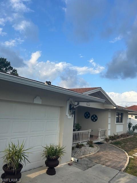 4201 19th Place Southwest Naples, FL 34116 - Photo 1 of 12 a view of a house with a porch