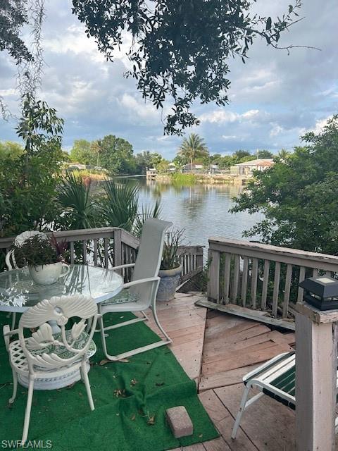4201 19th Place Southwest Naples, FL 34116 - Photo 4 of 12 a view of a chair and tables on the patio
