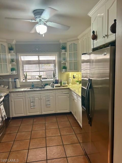 4201 19th Place Southwest Naples, FL 34116 - Photo 6 of 12 a kitchen with a stove a sink and a refrigerator