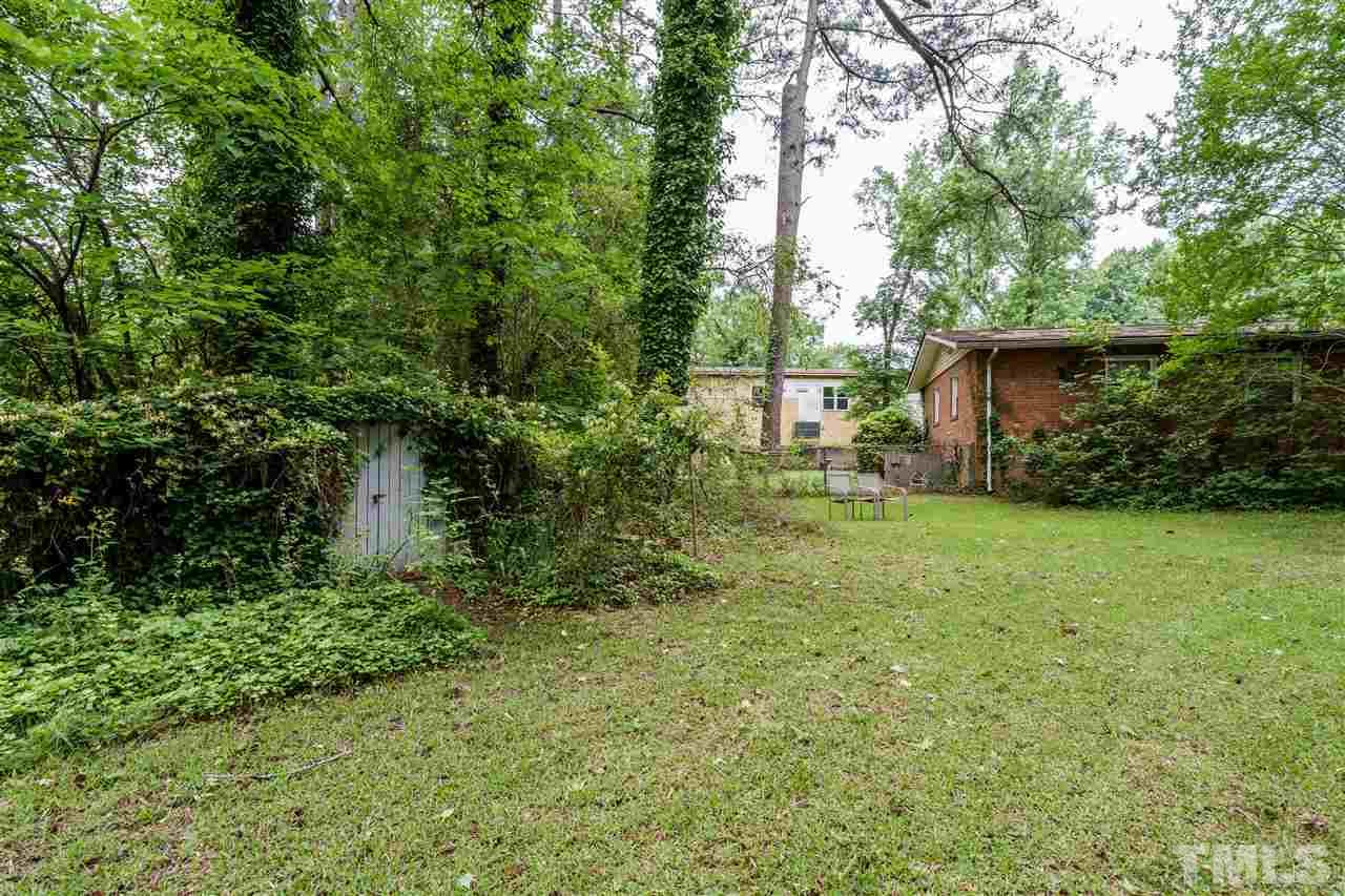 2534 Remington Road Raleigh, NC 27610 - Photo 22 of 25 a backyard of a house with lots of green space