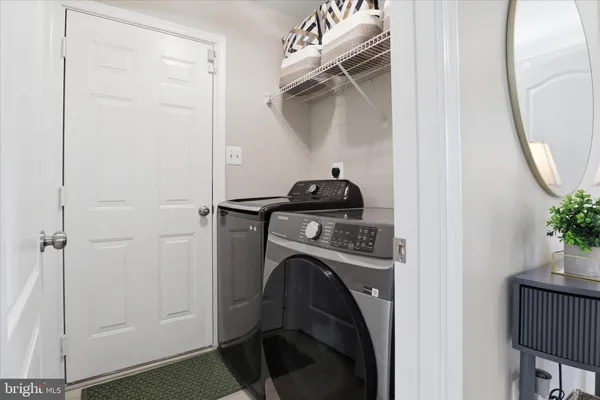 a bathroom with a double vanity sink and mirror