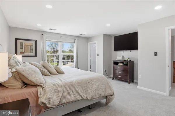 a bedroom with a bed and a cabinets
