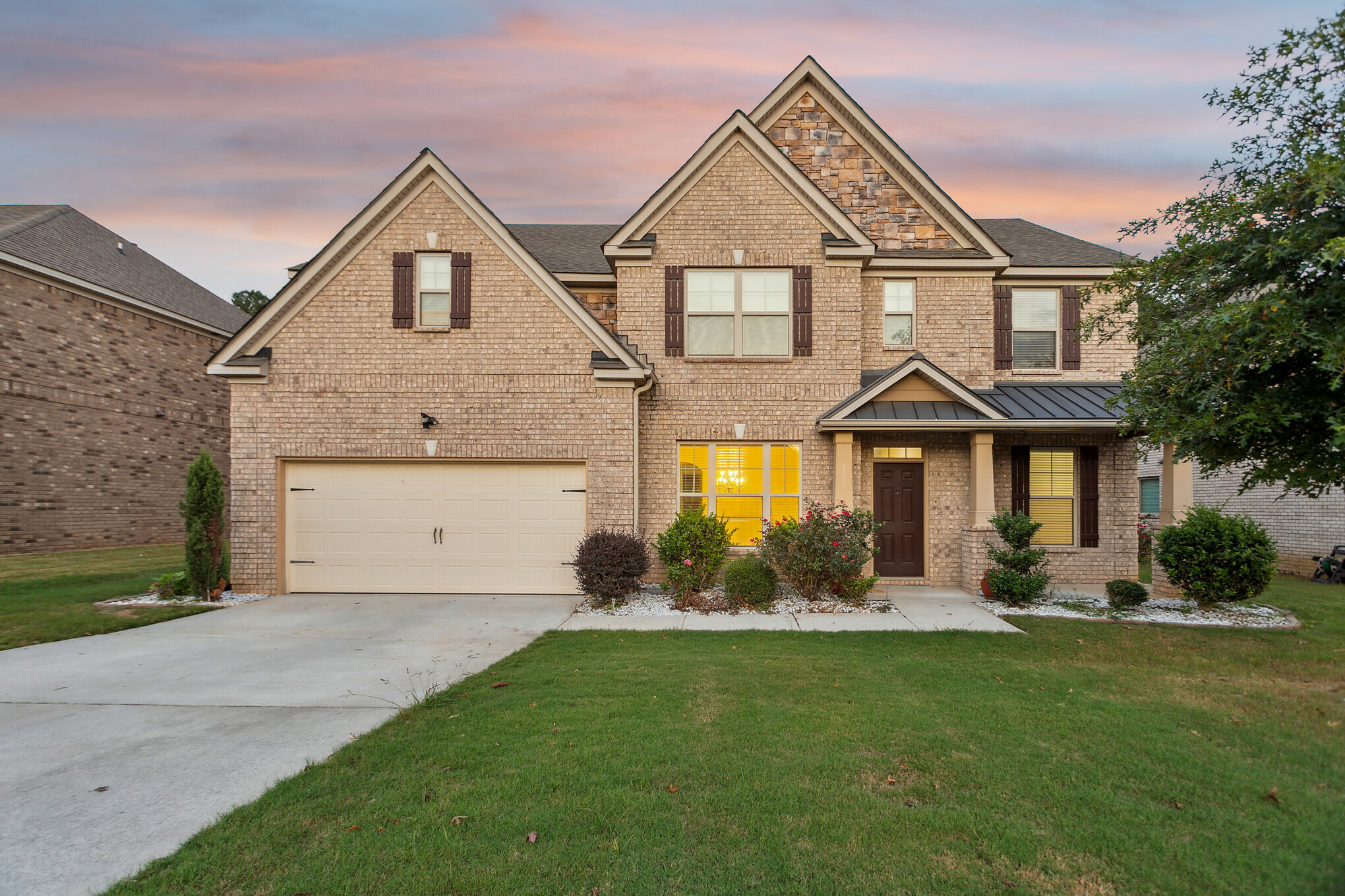 front view of a house with a yard