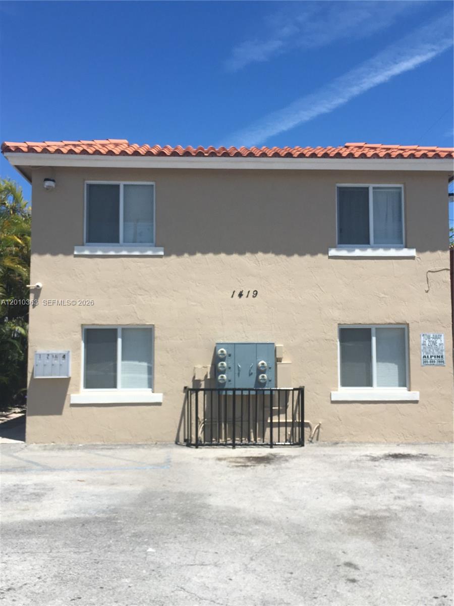 1419 Southwest 22nd Avenue, Unit 4 Miami, FL 33145 - Photo 2 of 11 a front view of a house with a garage