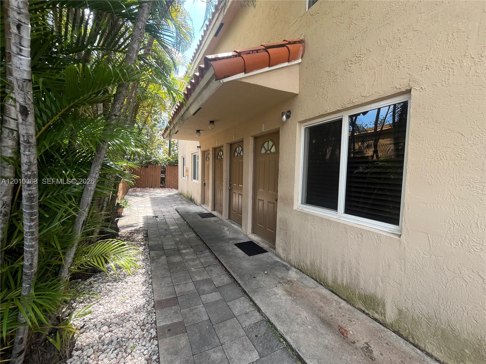 1419 Southwest 22nd Avenue, Unit 4 Miami, FL 33145 - Photo 3 of 11 a view of a pathway with a house