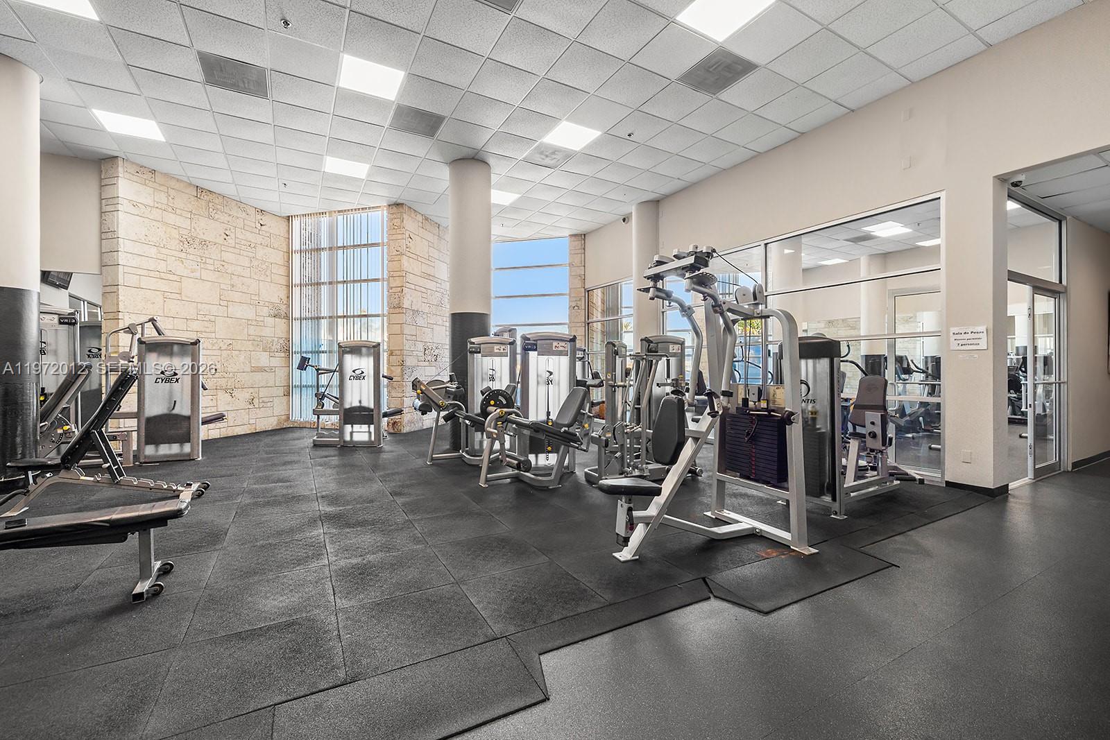 5161 Collins Avenue, Unit 910 Miami Beach, FL 33140 - Photo 12 of 18 a view of a room with gym equipment