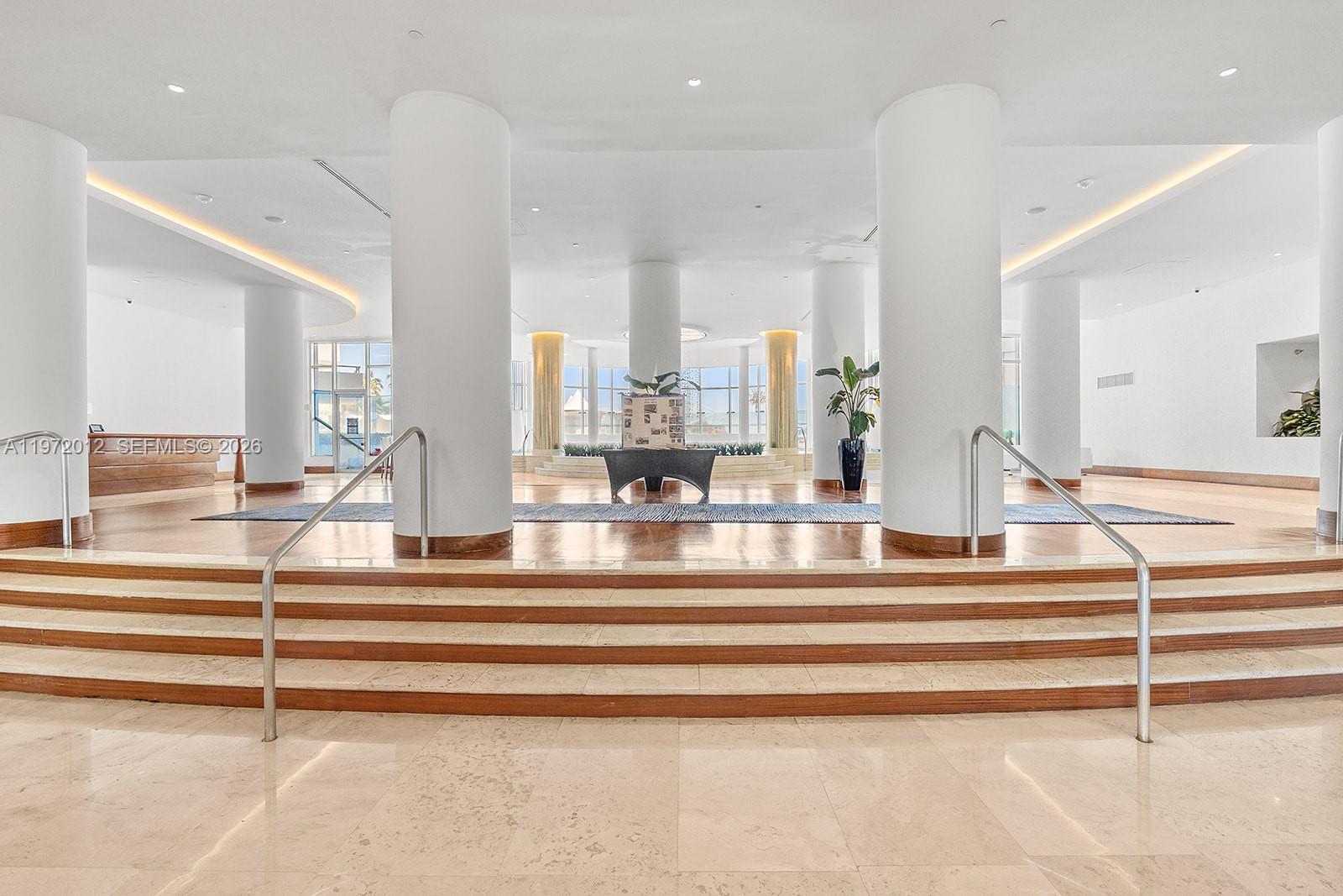 5161 Collins Avenue, Unit 910 Miami Beach, FL 33140 - Photo 2 of 18 a view of white room with granite countertop and white walls
