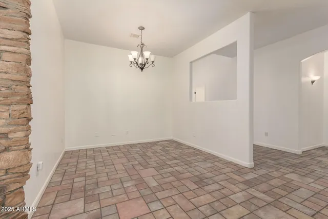 a kitchen with granite countertop stainless steel appliances a refrigerator and cabinets