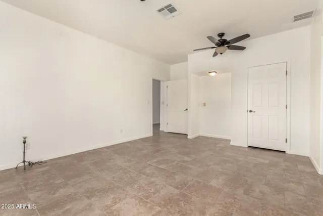 a bathroom with a sink a toilet a mirror and shower