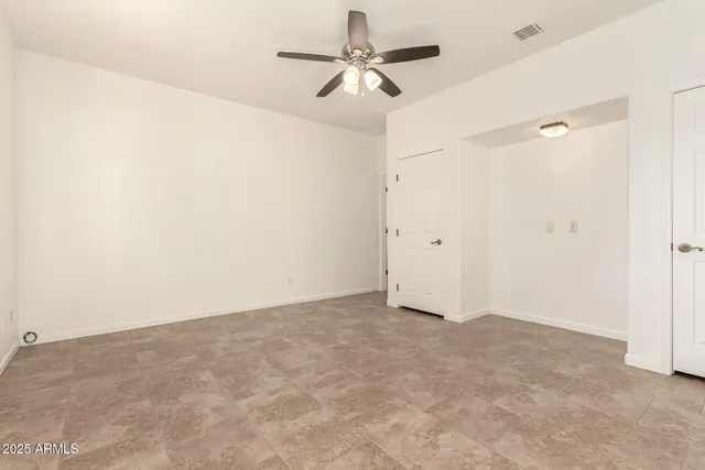 a white toilet sitting next to a bathroom sink