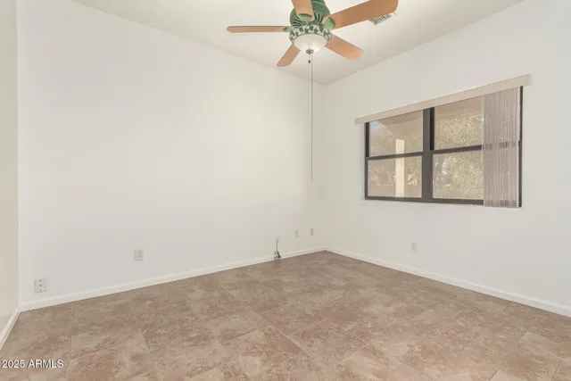 a white toilet sitting next to a bathroom sink and a bathtub