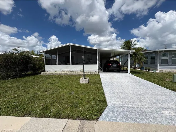 a view of a house with a back yard