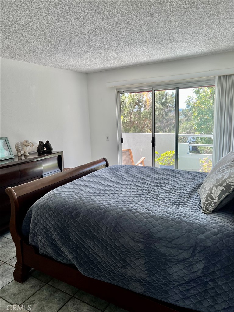 27857 Ruby, Unit 63 Mission Viejo, CA 92691 - Photo 17 of 23 a bed sitting in a bedroom next to a window