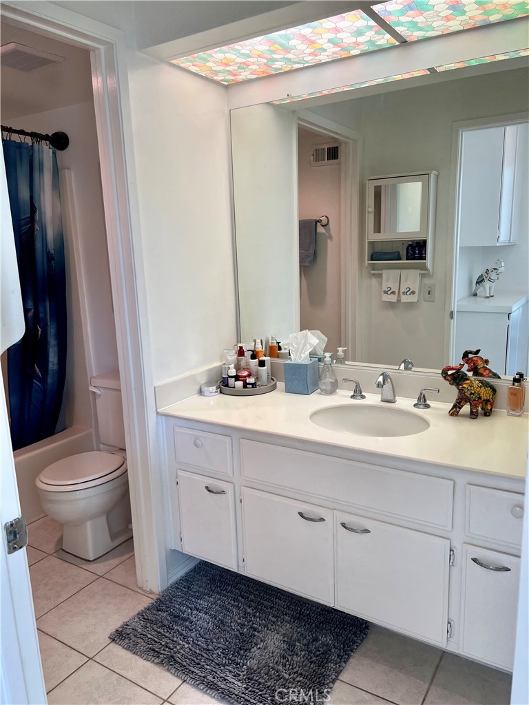 27857 Ruby, Unit 63 Mission Viejo, CA 92691 - Photo 18 of 23 a bathroom with a sink a toilet and mirror