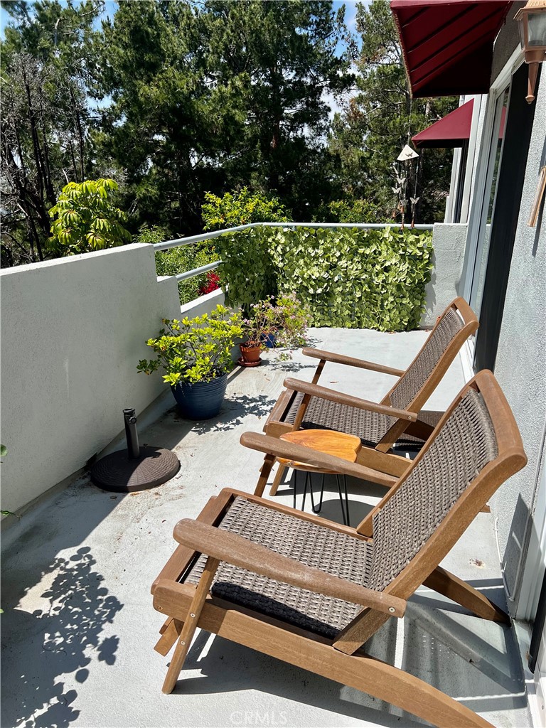 27857 Ruby, Unit 63 Mission Viejo, CA 92691 - Photo 9 of 23 a roof deck with table and chairs and potted plants