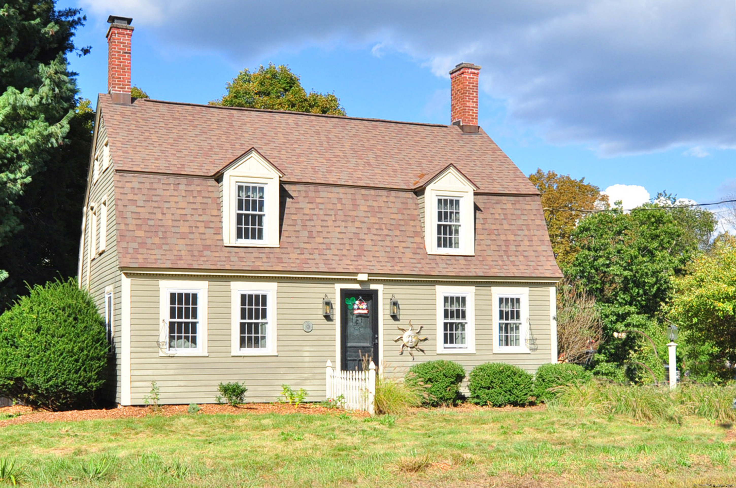 106 West Granby Road Granby, CT 06035 - Photo 1 of 1 a front view of a house with a yard