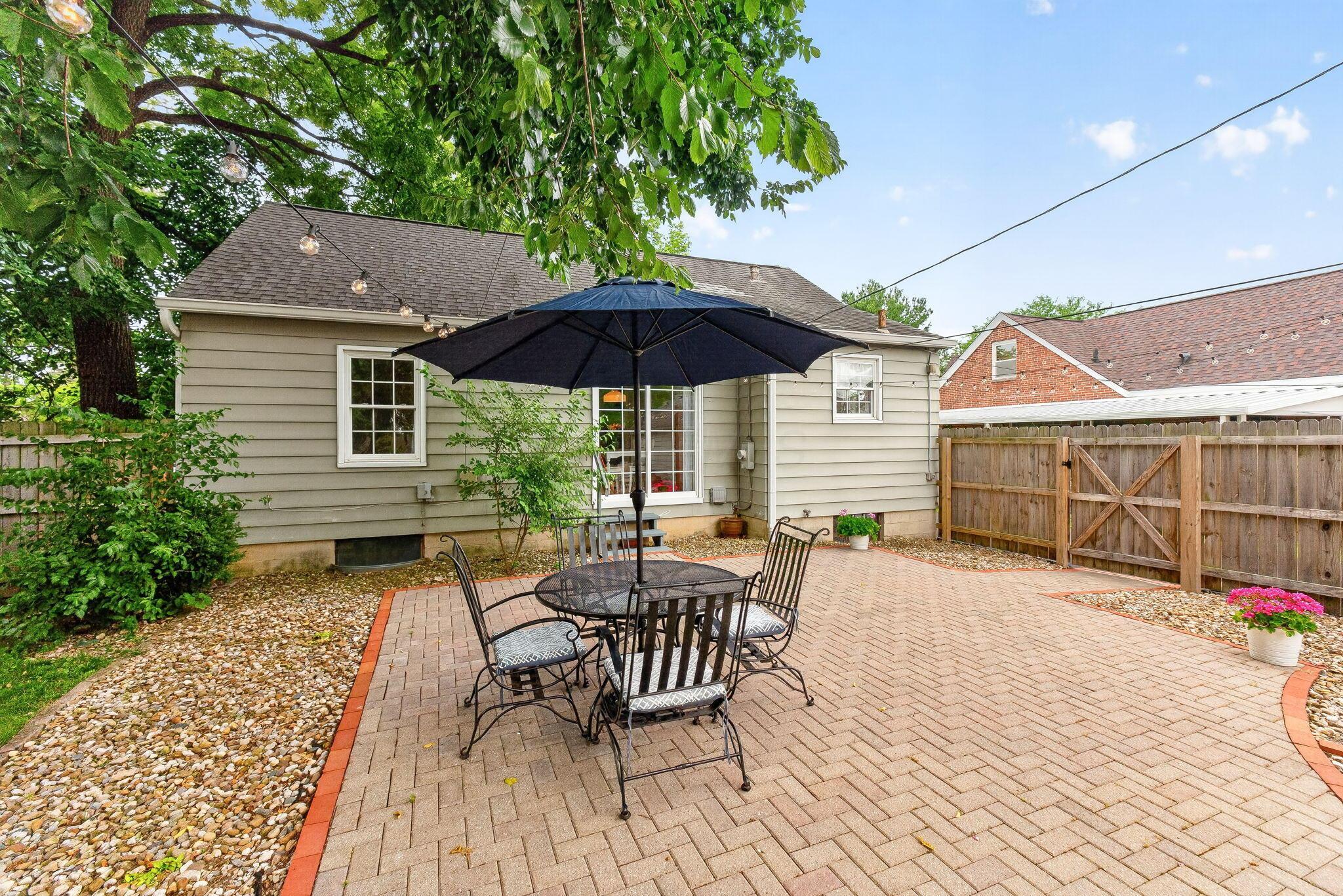 492 Wetmore Road Columbus, OH 43214 - Photo 39 of 55 Expansive brick paver patio featuring a herringbone pattern