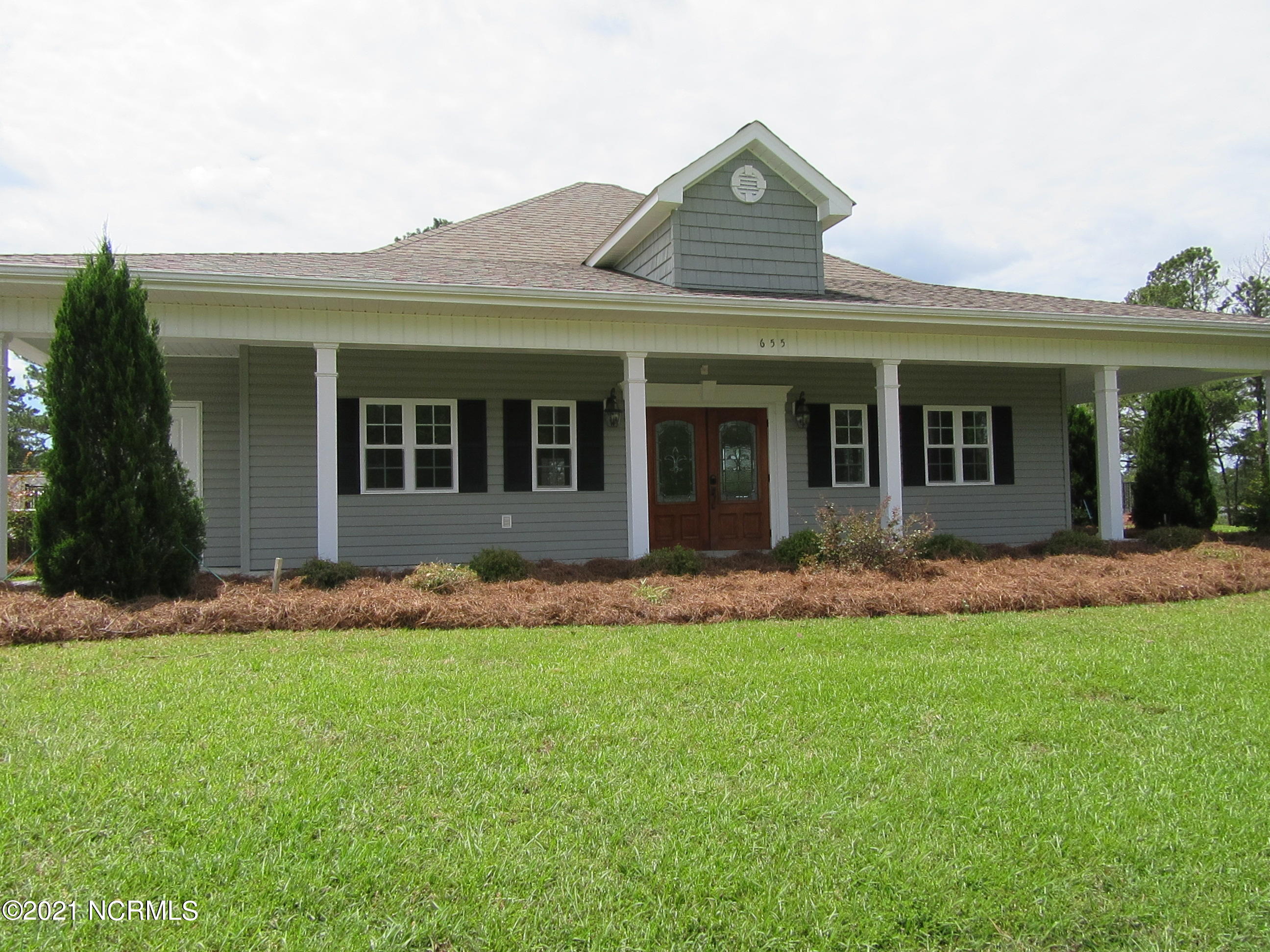 127 Corolla Loop Road Arapahoe, NC 28510 - Photo 5 of 7 Clubhouse Exterior