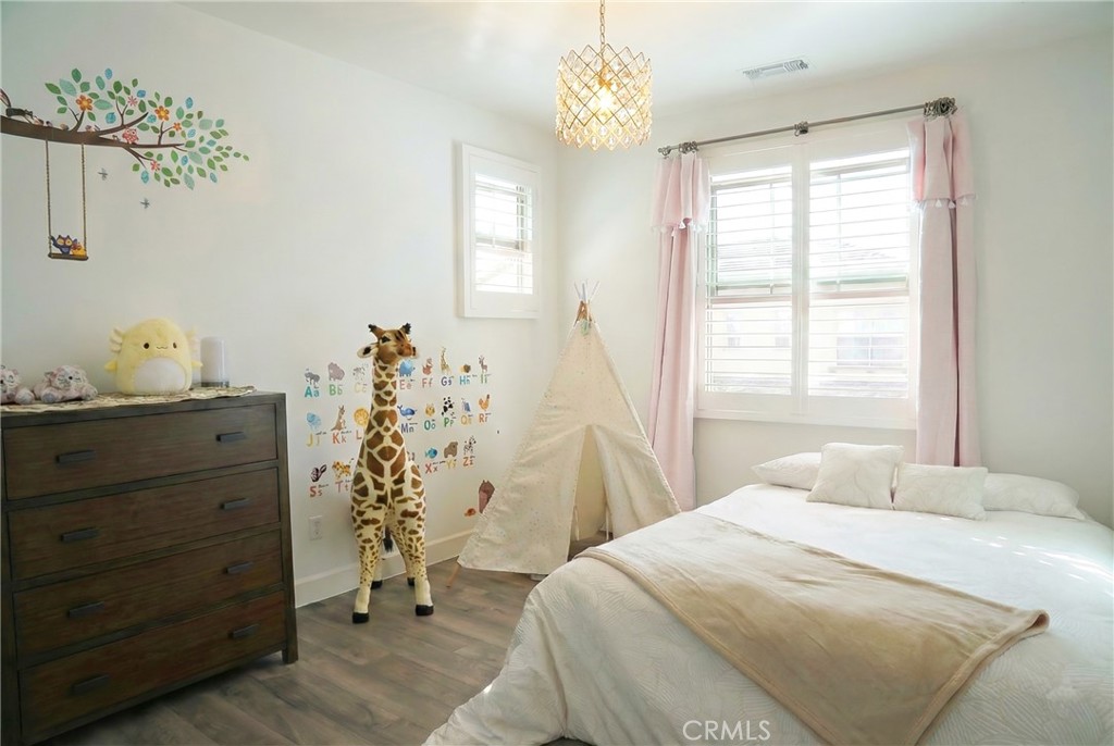 109 Sugar Cane Irvine, CA 92620 - Photo 14 of 26 a bedroom with a bed and a window