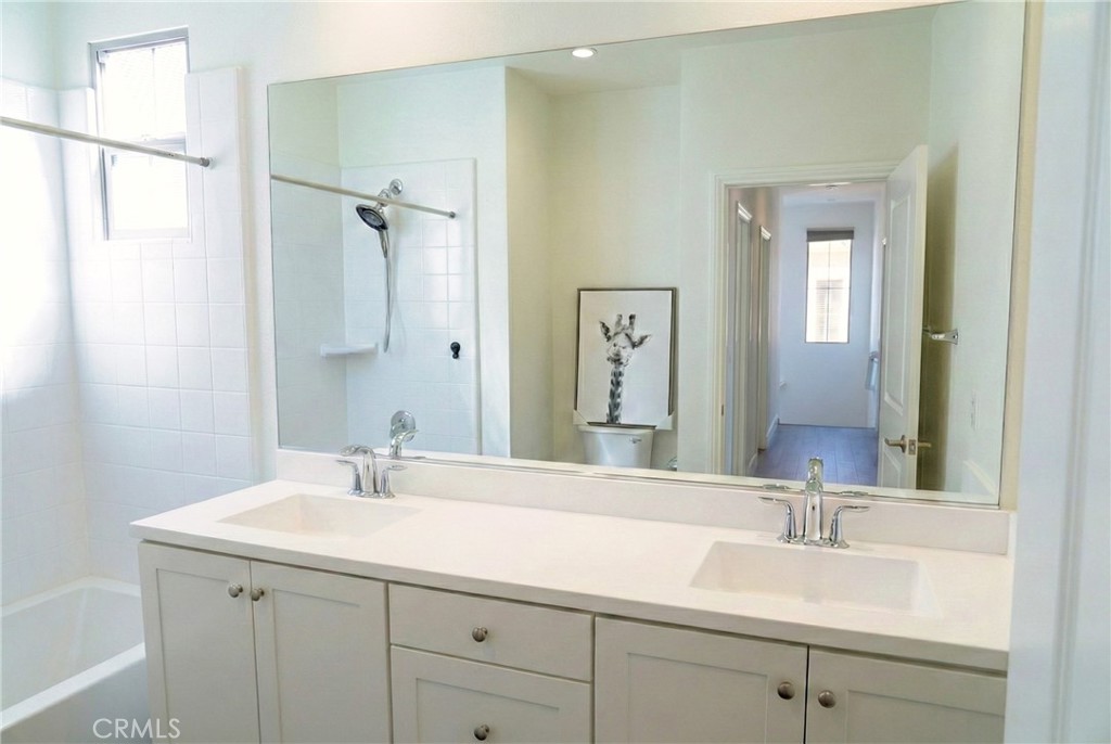 109 Sugar Cane Irvine, CA 92620 - Photo 15 of 26 a bathroom with a sink and a mirror