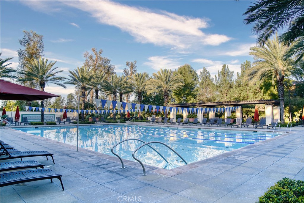109 Sugar Cane Irvine, CA 92620 - Photo 20 of 26 a swimming pool with outdoor seating and yard