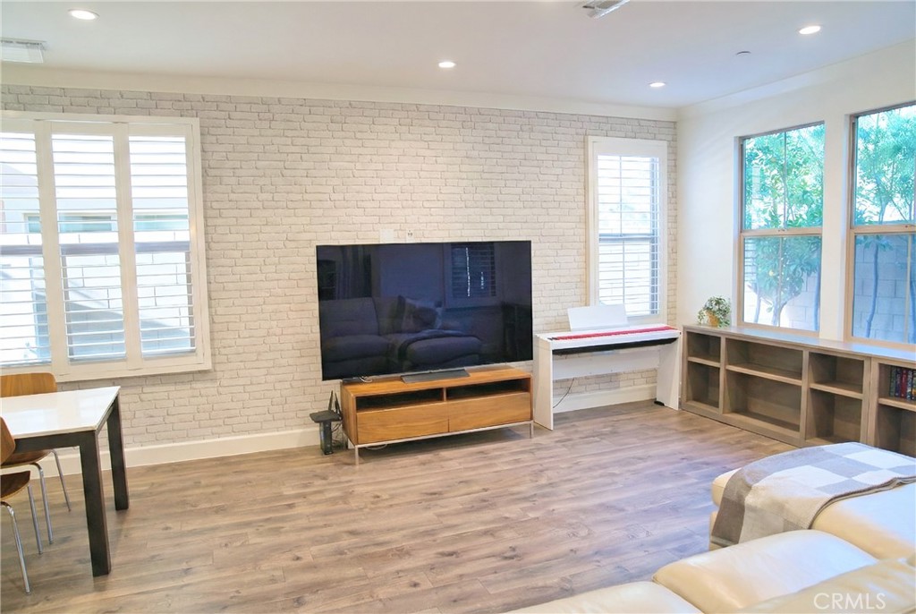 109 Sugar Cane Irvine, CA 92620 - Photo 3 of 26 a living room with furniture windows and wooden floor