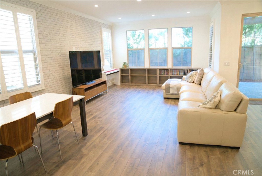 109 Sugar Cane Irvine, CA 92620 - Photo 4 of 26 a living room with furniture and a flat screen tv