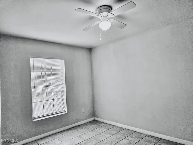 a view of a lake with a house in the background