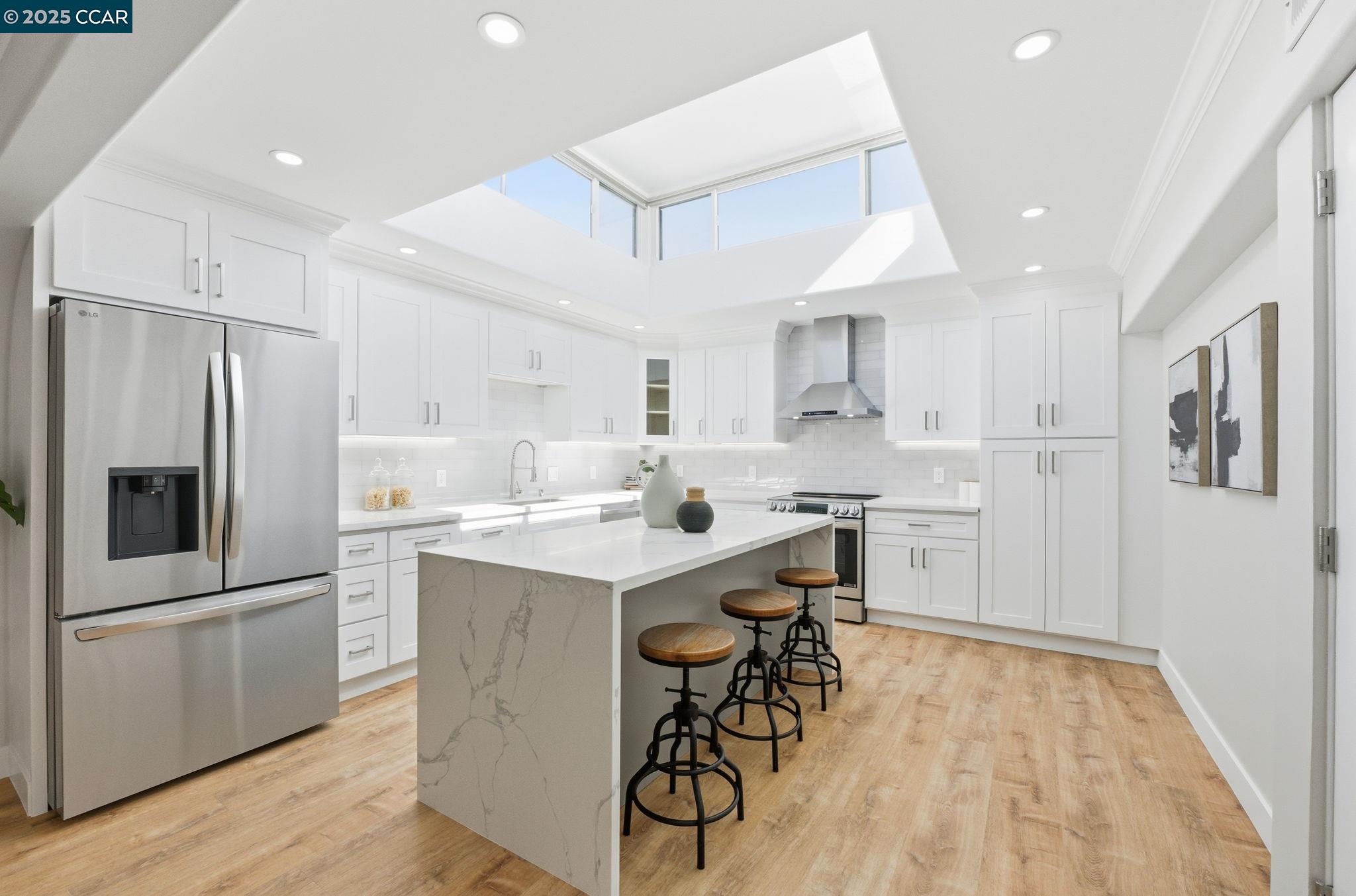 2132 Golden Rain Road, Unit 2 Walnut Creek, CA 94595 - Photo 1 of 38 a kitchen with a sink a refrigerator and a stove top oven
