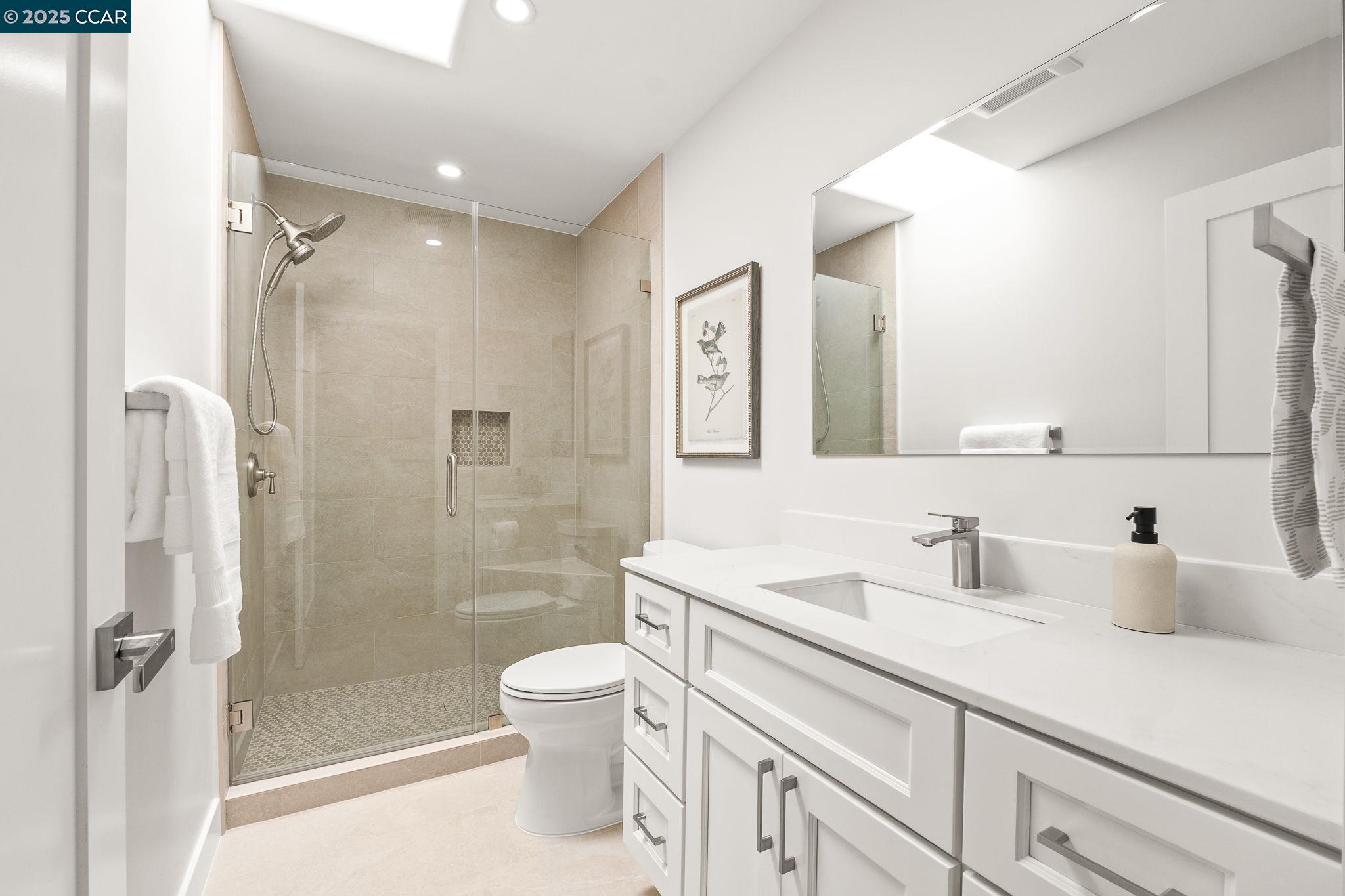 2132 Golden Rain Road, Unit 2 Walnut Creek, CA 94595 - Photo 13 of 38 a bathroom with a sink a toilet and shower