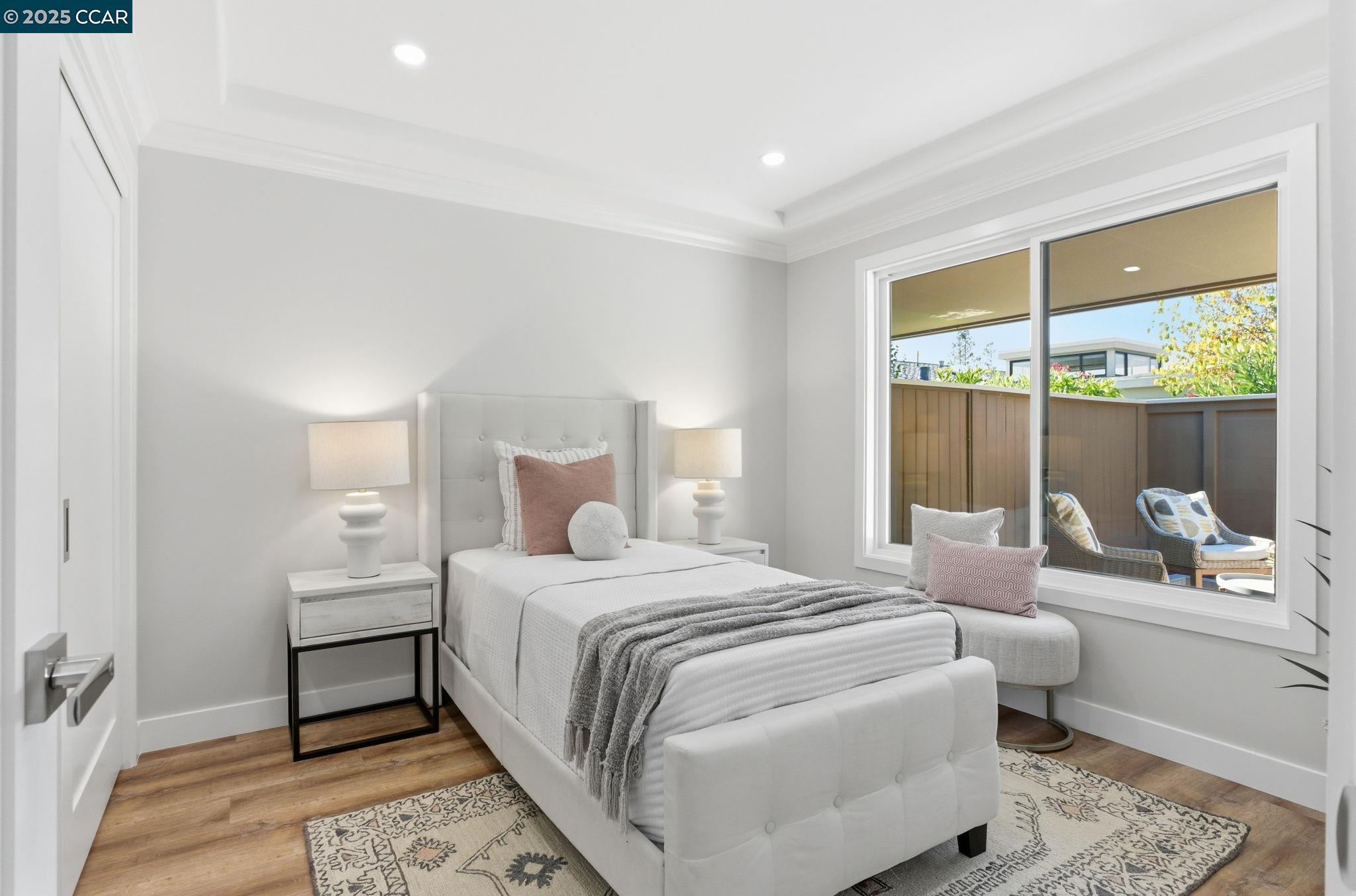 2132 Golden Rain Road, Unit 2 Walnut Creek, CA 94595 - Photo 17 of 38 a bedroom with a bed and a large window