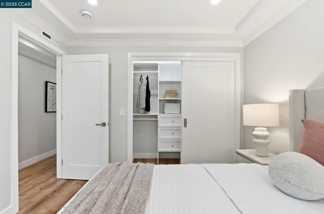 a bedroom with a bed and a view of bathroom