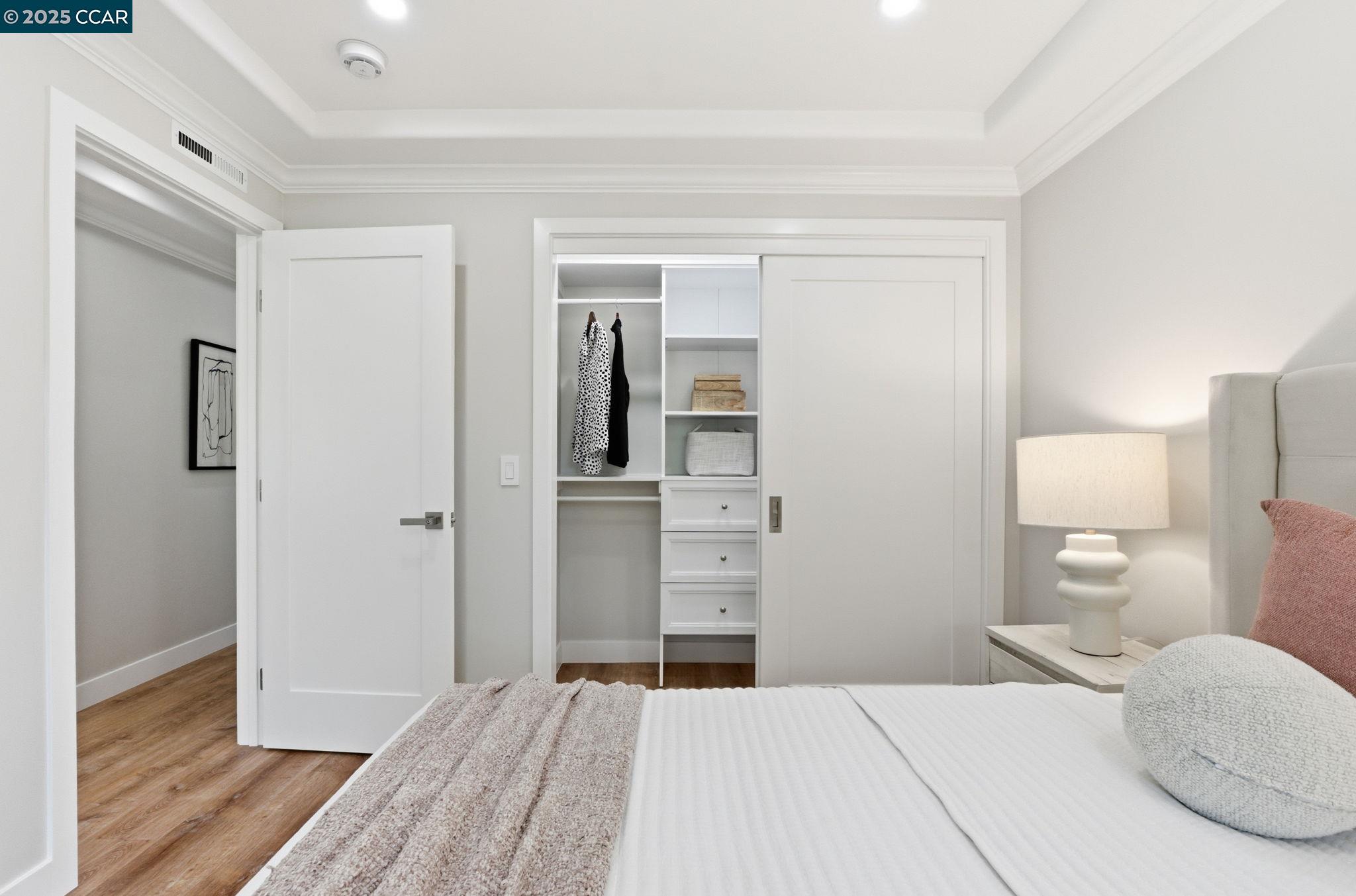 2132 Golden Rain Road, Unit 2 Walnut Creek, CA 94595 - Photo 19 of 38 a bedroom with a bed and a view of bathroom