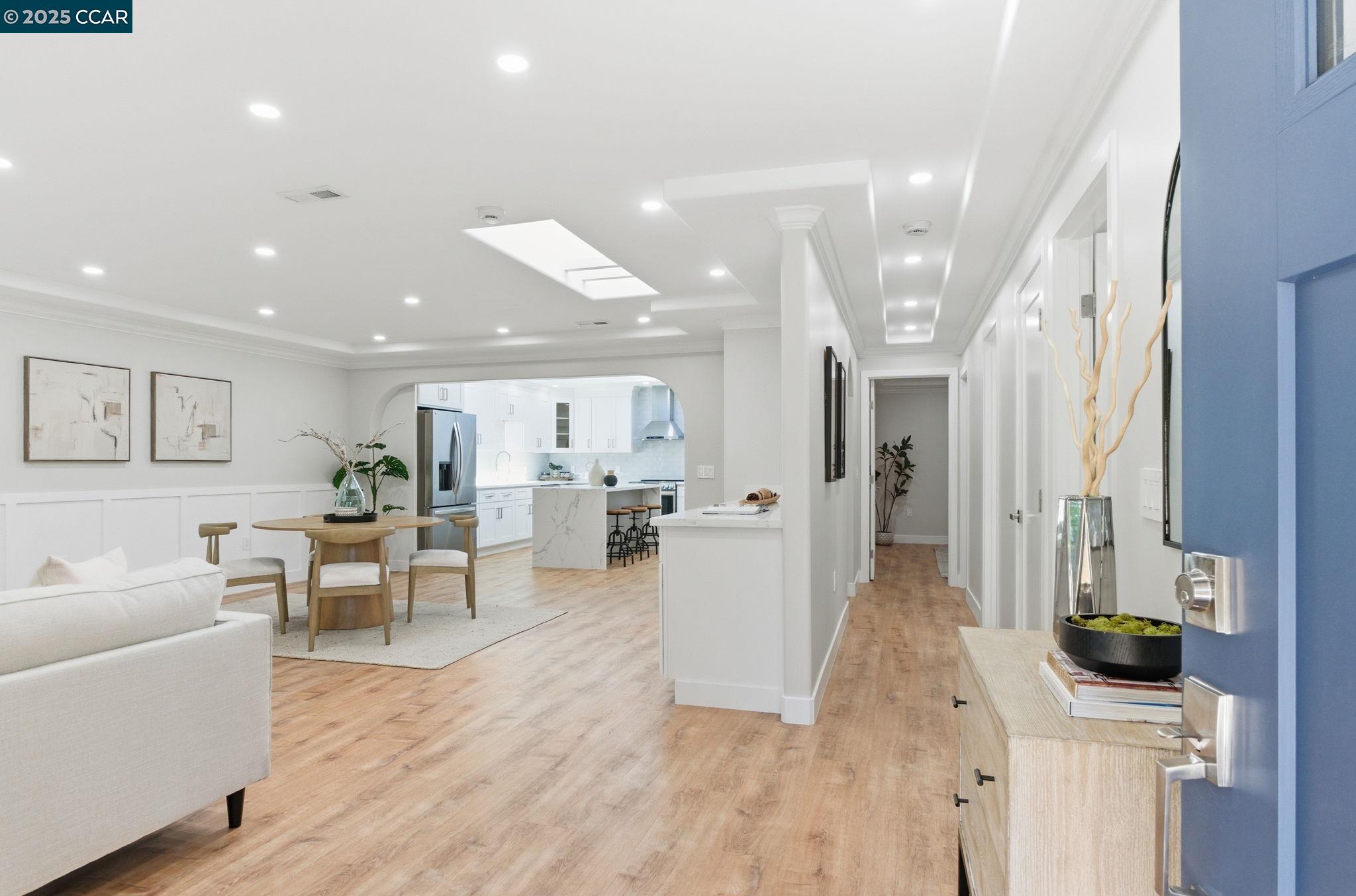 2132 Golden Rain Road, Unit 2 Walnut Creek, CA 94595 - Photo 20 of 38 a living room with furniture a wooden floor and a large window