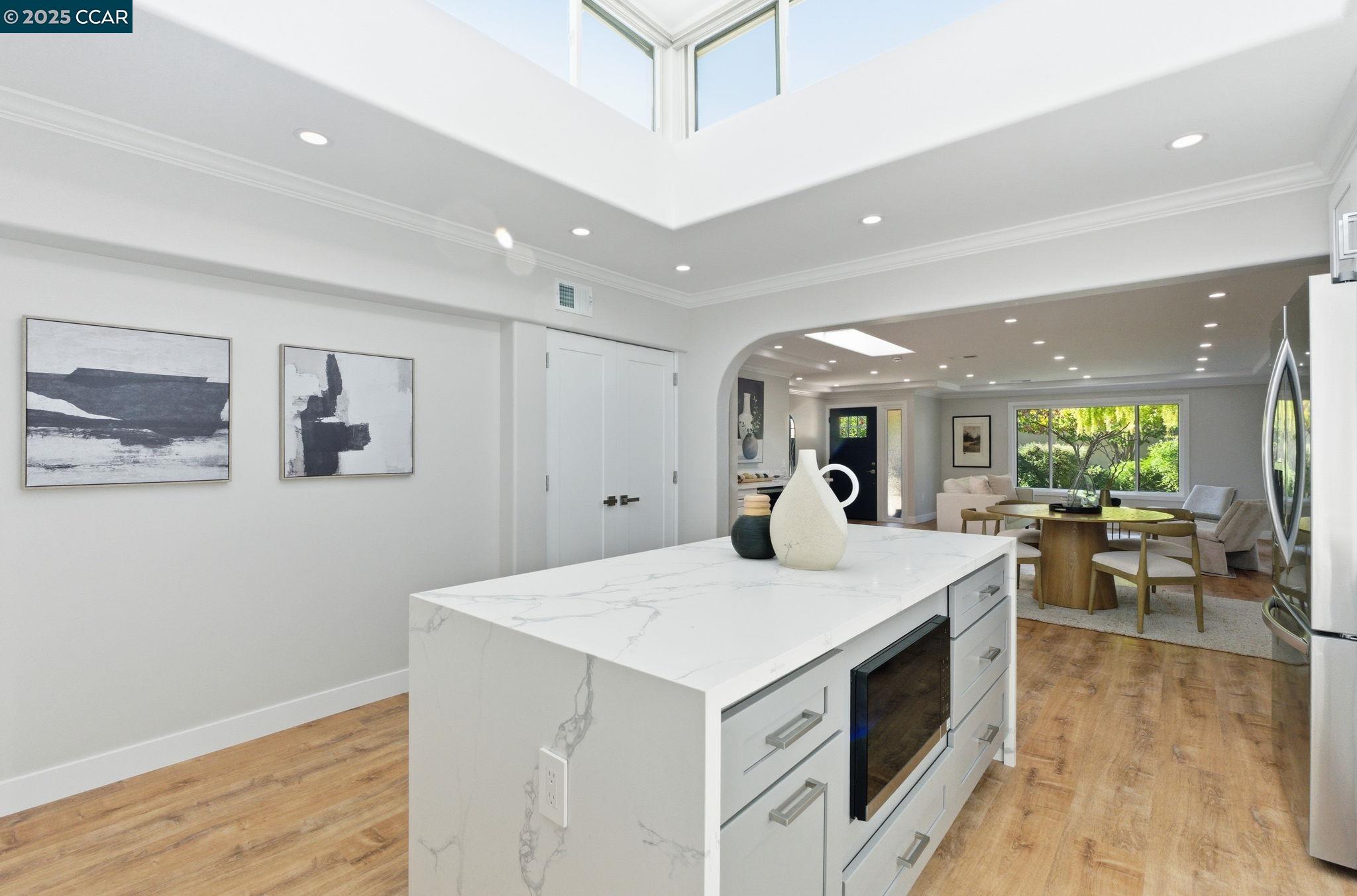 2132 Golden Rain Road, Unit 2 Walnut Creek, CA 94595 - Photo 21 of 38 a view of kitchen with furniture and wooden floor